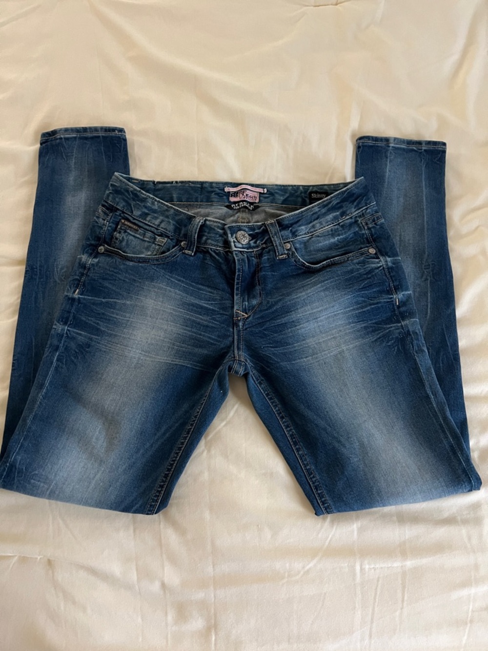 Women’s Mid Wash Skinny Jeans with Subtle Whiskering